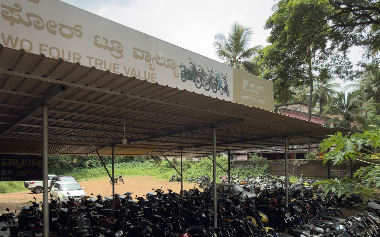 Two Four True Value covered two-wheeler showroom